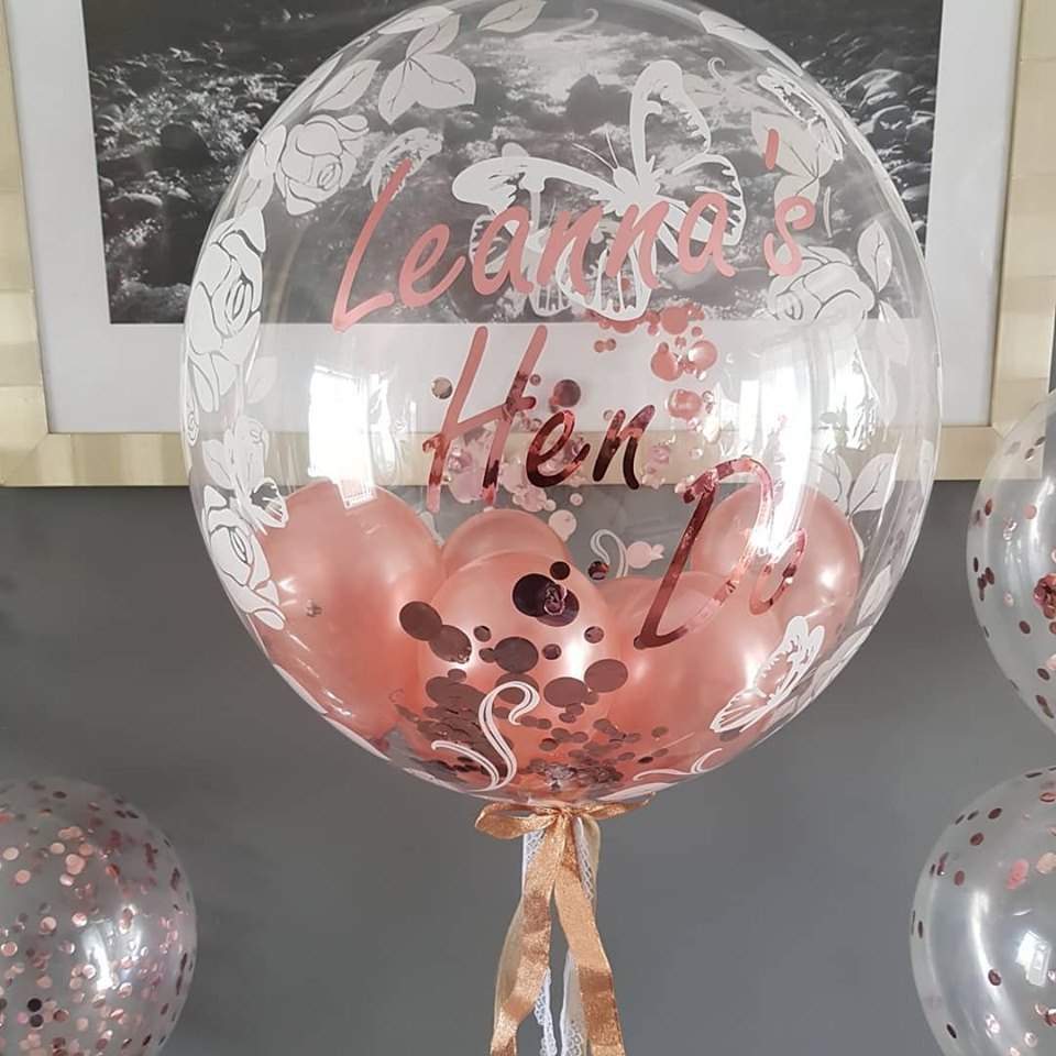 Personalised bubble balloon with flower print and rose gold lettering